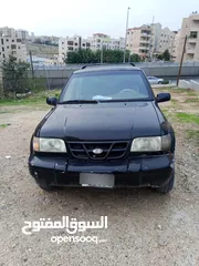  3 كيا سبورتج 2001 لون اسود للبيع