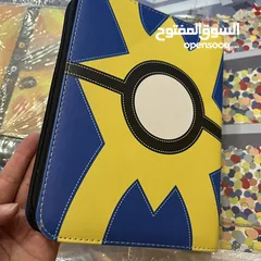  3 كروت بوكيمون والبومات (Pokemon cards and binders)