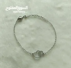  2 اسوارة ستيل مع تعليقة قلوب حب