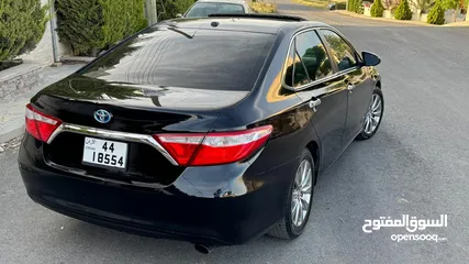  18 تويوتا كامري هايبرد بطاريه مركزيه اعلا صنف فل كااااامل بحاله الوكاله