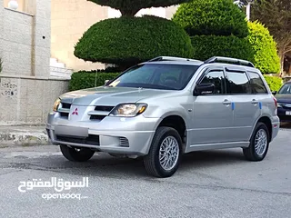  10 ميتسوبيشي آوتلاندر اوتوماتيك 2003 توب نظافة بسعرررر مميززز محرك 2400cc