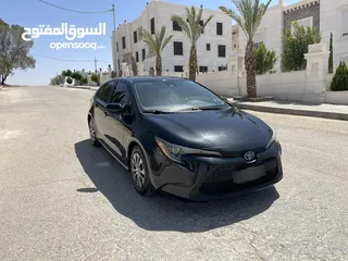  1 تويوتا كورولا 2020 هايبرد لون اسود حره باسم المستورد