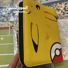  5 كروت بوكيمون والبومات (Pokemon cards and binders)