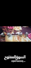 12 30 kg dumbbells new only silver cast iron with the bar connector and the box