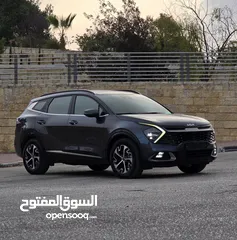  2 كيا سبورتاج هايبرد 2023 - فل كامل مع بانوراما - غرفة مميزه - عداد قليل اصلي - إمكانية التقسيط.