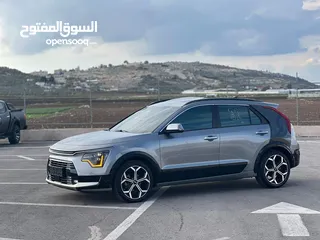  18 كايا نيرو  هايبرد (بنزين+كهرباء ) فل الفل  فتحة سقف  لون مميز اضافات مميزة /2022 جناح اسود