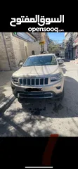  1 جيب شروكي 2014 دفع رباعي  ماشية 117000كم  4*4دفع رباعي