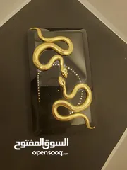  16 حقيبة كلاتش من ماركة كيليان ذا تمبتريس سوداء وراقيه ،Black Clutch The Temptress by Kilian