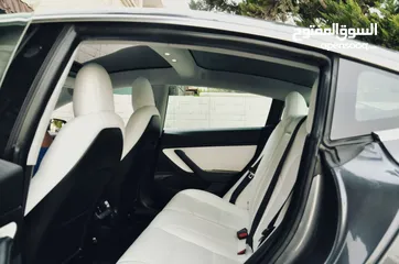  7 Tesla model 3 midrange 2019  (داخلية بيضاء)