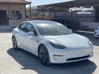  1 Tesla model 3 2023 لون آبيض لؤلؤي