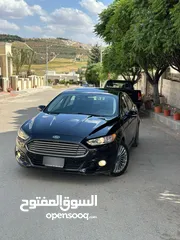  2 فورد فيوجن 2014 هايبرد تيتانيوم فل اضافات ماشيه 70 الف فقط بحاله الشركة