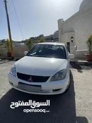  1 متسوبيشي لانسر موديل 2014 GLX لون ابيض فحص كامل