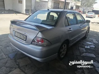  2 لانسر 2007 ماتور 1600 قير توماتيك CVT فحص خالي قص قلبان دهان جديد غرفه بيج ترخيص لشهر 24\1