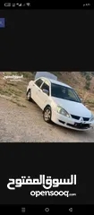  2 لانسر موديل 2010  لونها ابيض