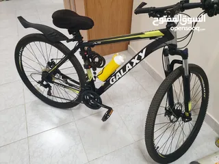 1 دراجة جبلية جلاكسي A5، مقاس 29 ، مزودة ب 21 سرعة، لون أسود × أصفر