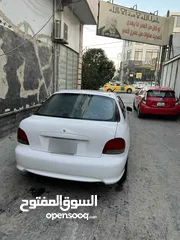  7 اكسنت 97 لون ابيض فيها ضربه بالجناح