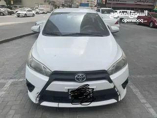  1 Toyota Yaris white hatchback 2016