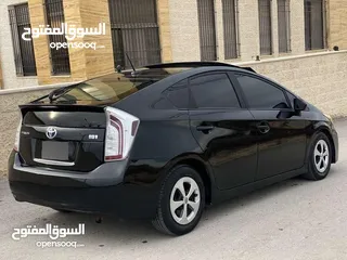  9 تويوتا بريوس 2015 هايبرد فل كامل مع بانوراما أعلى صنف بكج ( 5) لون اسود مميز