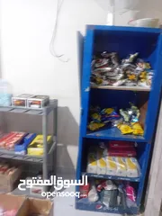  10 اثاث بقاله واجهه المنيوم وباب حديد سحاب