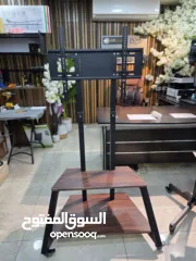  1 ستاند تلفزيون متحرك حديد + خشب (ثقيل ومتين) يتحمّل شاشات لغاية 85 بوصة هيكل حديد سميك قوي جدًا .