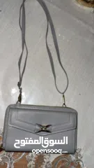  1 شنطة كتف رمادية