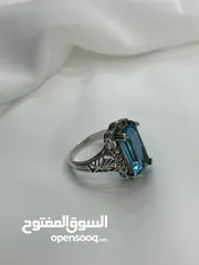 5 *خاتم فضة بحجر أكوامارين – عيار 925، وزن 5.4 جرام