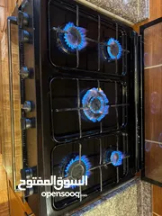  4 فرن غاز و غسالة اوتوماتيك و طاولة سفرة