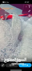  1 فستان زفاف ابيضّ