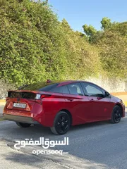  9 تويوتا بريوس برسونا 2021 لون احمر مميز جمرك جديد