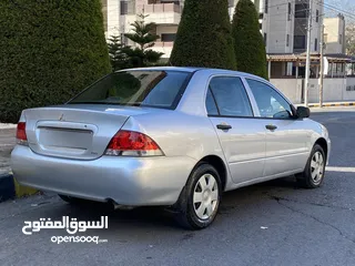  20 مستوبيشي لانسر  موديل 2005  وارد الوكالة مالك واحد