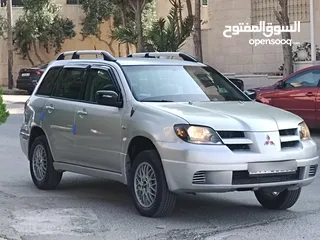  15 ميتسوبيشي آوتلاندر اوتوماتيك 2003 توب نظافة بسعرررر مميززز محرك 2400cc