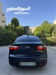  6 كيا ريو 2014 متور 1250 بنزين جير عادي فحص ممتاز  لون كحلي فرش بيج تحكم ستيرنج