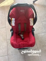  1 كرسي سيارة للأطفال ماركة Graco