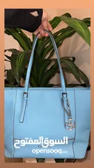  1 GUESS tote bag...beautiful turquoise color...worn once...like new 35jds