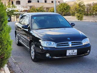  19 كيا سبكترا  موديل 2000لون اسود محرك 1500بحالة الوكالة فحص امامي دقات خلفي جيد جيد بحالة الوكالة