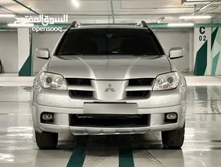  1 ميتسوبيشي أوتلاندر 2005 فورويل فل كامل ما عدا الفتحه