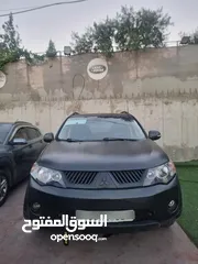  5 ميسوبيشي اوتلاندر 2009.  7ركاب   اصل برايفت  لون اسود مط   تشقيل بصمة  فتحة س