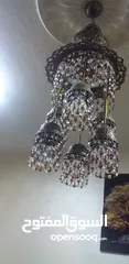  2 ثريا كرستال لون عسلي وابيض مكونه من سبع لمبات اضاءه ممتازه بسعر مغري