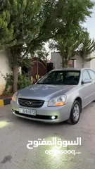  24 كيا لوتزي 2006 3 جيد لون سلفر ماتور 2000cc