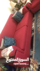  2 طقم كنب لون احمر و طاولات ستان ستيل و زجاج