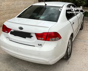  1 كيا لوتزي 2009 تب ترنك كيا لوتسي اوبتما لون ابيض