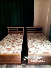 2 تخت خشب مفرد مستعمل