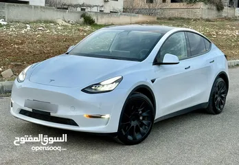  8 Tesla Model Y Long Range Dual motor  موديل 2021 لون لؤلؤي وداخليه اسود فحص اوتوسكور %81 B+