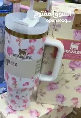  2 Stanely cup new style مطرة ستانلي برسمة جديدة مختمة ختم الاصلي  لون ابيض مورّد بزهر تحفظ البرودة