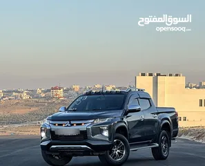  5 ميتسوبيشي L200 2023 لون فيراني مميزه فحص كامل كرت ابيض 7 جيد وارد الشركه