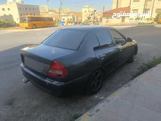 1 متسوبيشي لانسر مديل ال 97 جير عادي لون فيراني