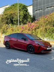  1 تويوتا بريوس برسونا 2021 لون احمر مميز جمرك جديد