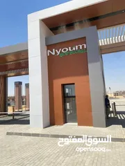  2 شقة للبيع  ارضي بجاردن  بكمبوند Nyoum Mostakbal نيوم المستقبل سيتي  بجوار مدينتي
