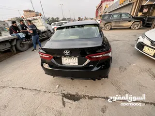  7 Toyota Camry  2018 SEبلس  لون اسود رقم بغداد  محرك اربعه سلندر 2500