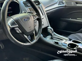  18 فورد فيوجن 2014 هايبرد تيتانيوم فل اضافات ماشيه 70 الف فقط بحاله الشركة